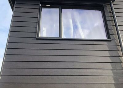 Newly-installed dark grey wall cladding in the 2nd floor area
