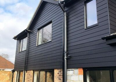 Newly-installed dark grey wall cladding in 2nd floor area